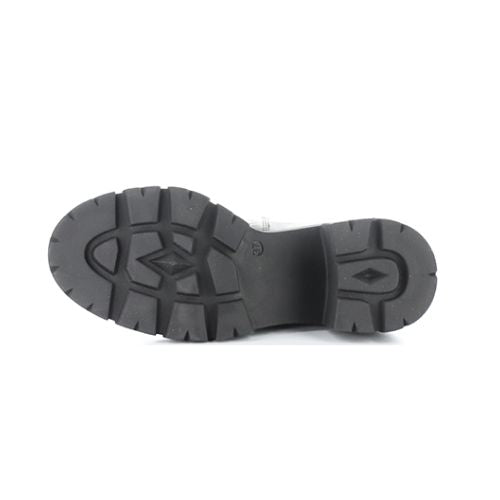 Lugged outsole of heeled Chelsea boot.