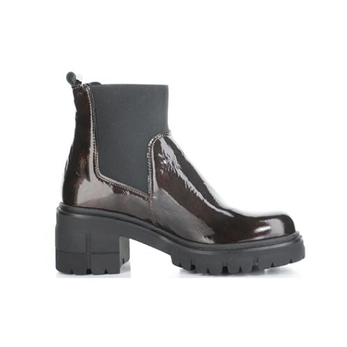 Profile of A marbled dark brown patent heeled Chelsea boot with elastic side goring, a heel pull tab, and thick lugged outsole.