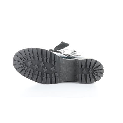 Black treaded outsole of combat boot.