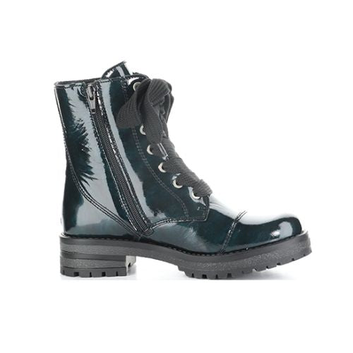 Profile of dark green patent leather combat boot with oversized black lace bow, side zipper and treaded outsole.