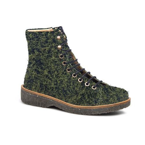 A green textured combat boot with an adjustable lace closure and a natural rubber outsole.
