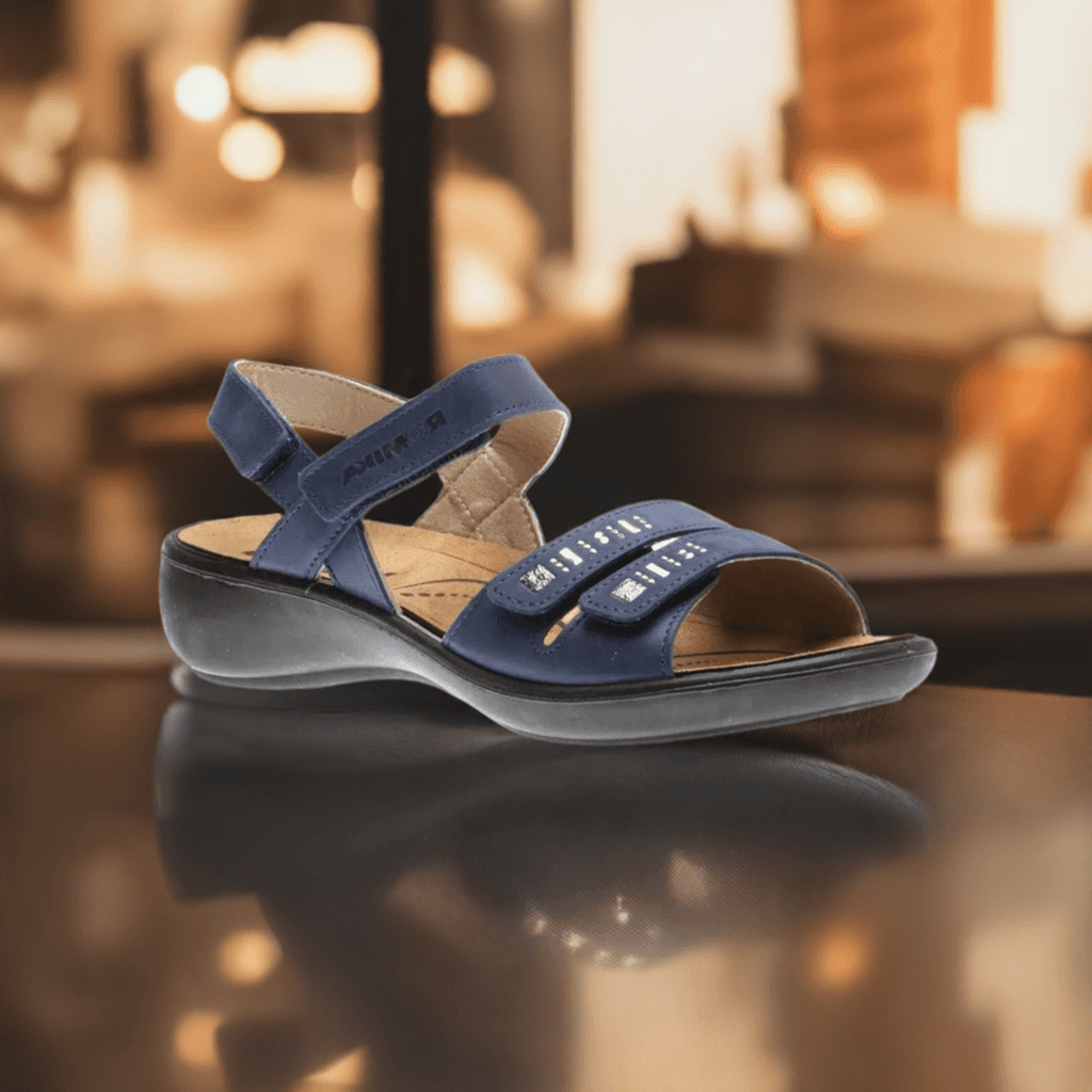 Stylish Josef Seibel Ibiza 86 sandal in navy blue displayed in a warm indoor setting, featuring premium leather and a cushioned footbed.