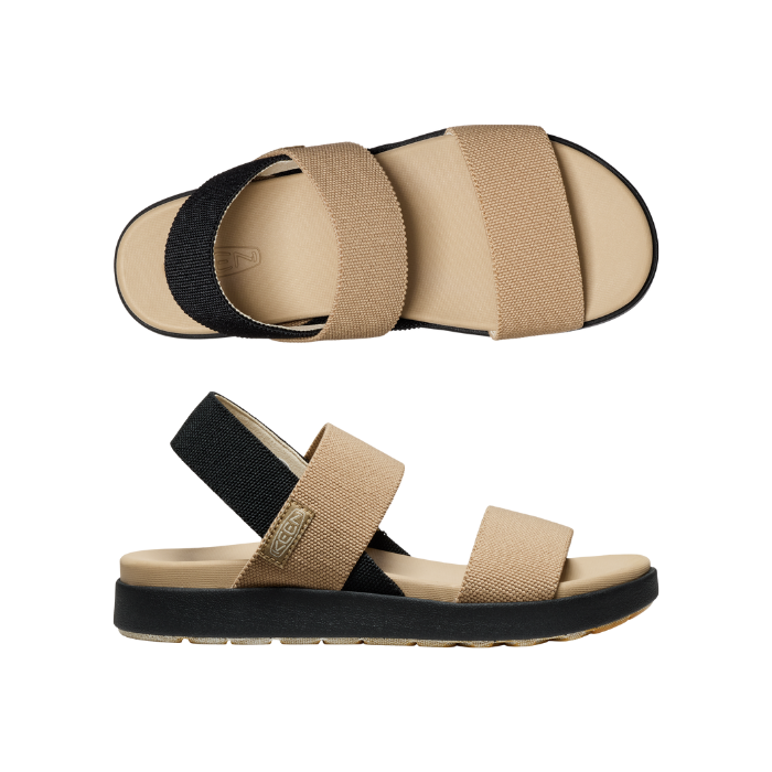 Pair of beige elastic strap sandals with black backstrap and black outsole.