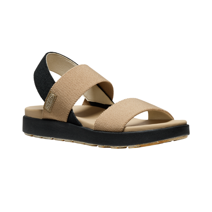 Beige elastic strap sandal with black backstrap and black outsole.
