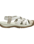 Walking sandal with criss crossing straps in various shades of white and rugged brown outsole.