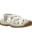 Walking sandal with criss crossing straps in various shades of white and rugged brown outsole.