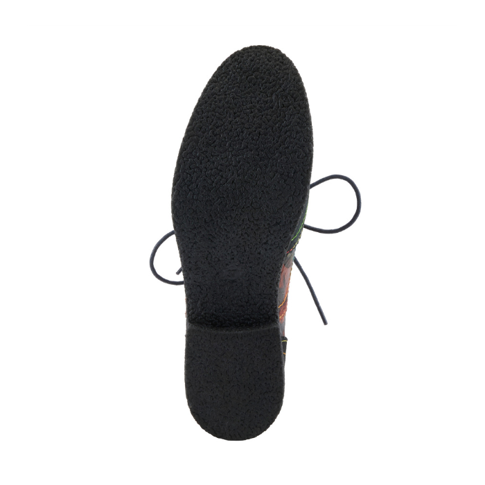 Black light treaded pebbled pattern outsole of oxford shoe.