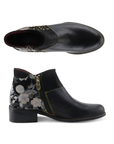 Pair of black leather ankle boot with a low block heel, gold-tone studs on the side, rainbow stitching detail, inside zipper and a floral-patterned heel panel.