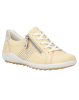 Pale yellow Lace-up sneaker with pale gold accents, side zipper, accent stitching,  and white midsole.