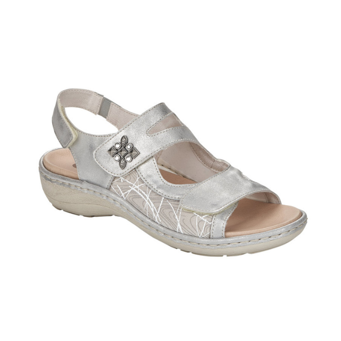 Silver backstrap sandal with 3 adjustable Velcro closures, sparkly square emblem on ankle strap and silver details along side.