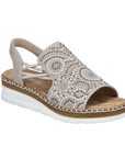 Beige sandal with rhinestone embellishments and platform white wedge.