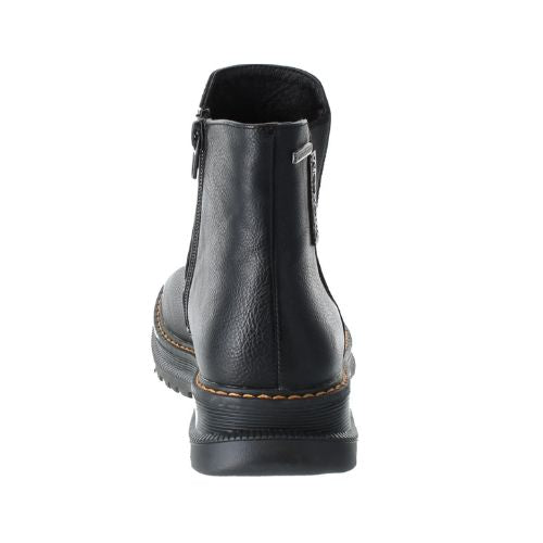 Heel view of black Chelsea boot with side zipper,  tan stitching and a lugged outsole.