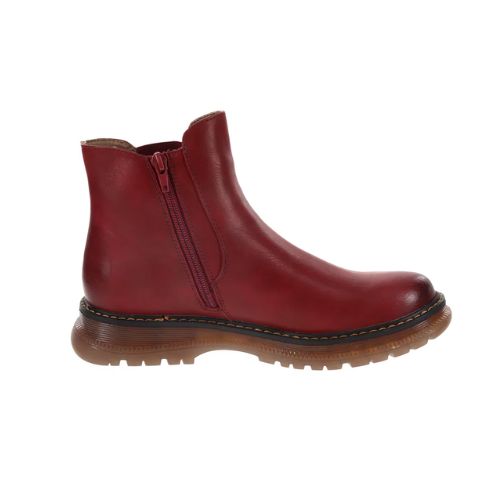 Profile of a red Chelsea boot with side zipper, accent tan stitching and a lugged outsole.