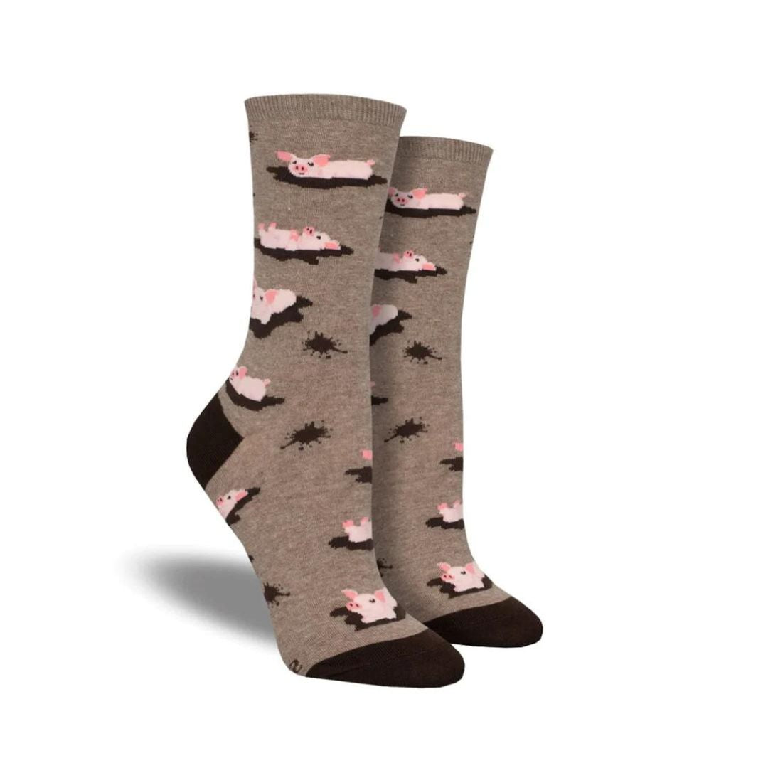 Socksmith Women's Pig Out Socks featuring playful pigs in mud on a beige background. Available at White-Balmer Shoes with free shipping over $100.