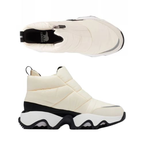 Pair of A white Puffy upper front Zip Ankle Boots with white midsole, black Sorel logo'd footbed and a wave pattern rubber outsole.