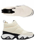 Pair of A white Puffy upper front Zip Ankle Boots with white midsole, black Sorel logo'd footbed and a wave pattern rubber outsole.