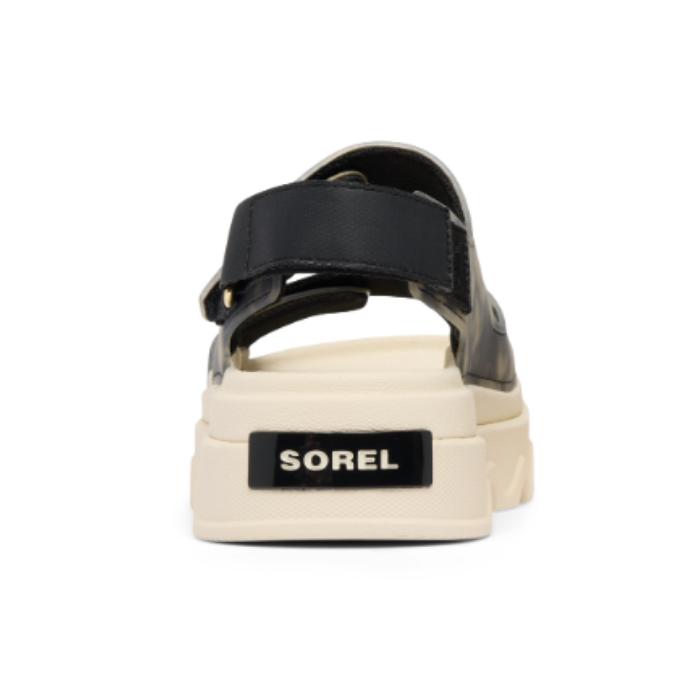 Black camouflage sandal with white sole with the Sorel logo on heel.