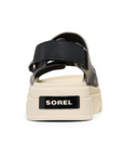 Black camouflage sandal with white sole with the Sorel logo on heel.