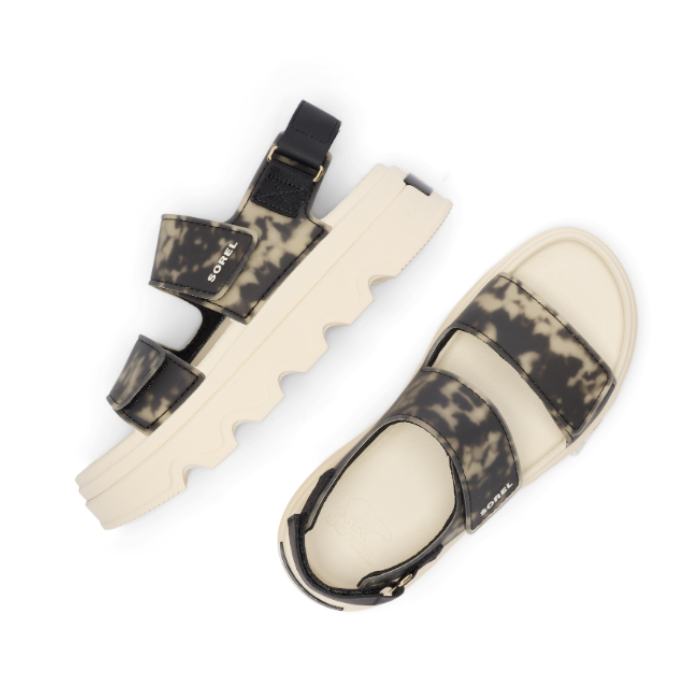 Pair of Ankle strap Sandals with camouflage straps and  thick white lugged outsole.