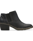 Low Block heel black ankle boot with side goring, detailed stitching and dark brown rocker shaped outsole.