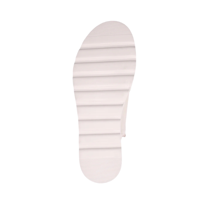 White deep lined outsole of sandal.