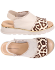 Pair of Almond and leopard sandals with gold stitching accents, elastic backstrap, tan Django & Juliette logo'd footbed and off-white outsole.
