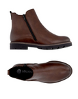 Pair of Brown Chelsea boot with side goring, inside zipper and lugged outsole. 