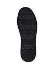 Black light treaded rubber outsole of sneaker with Remonte logo stamped in heel.