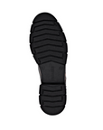 Black treaded rubber outsole of combat boot with Remonte logo stamped in middle.