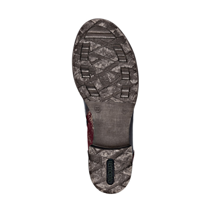 Greyish brown light treaded outsole with green Remonte logo on heel.