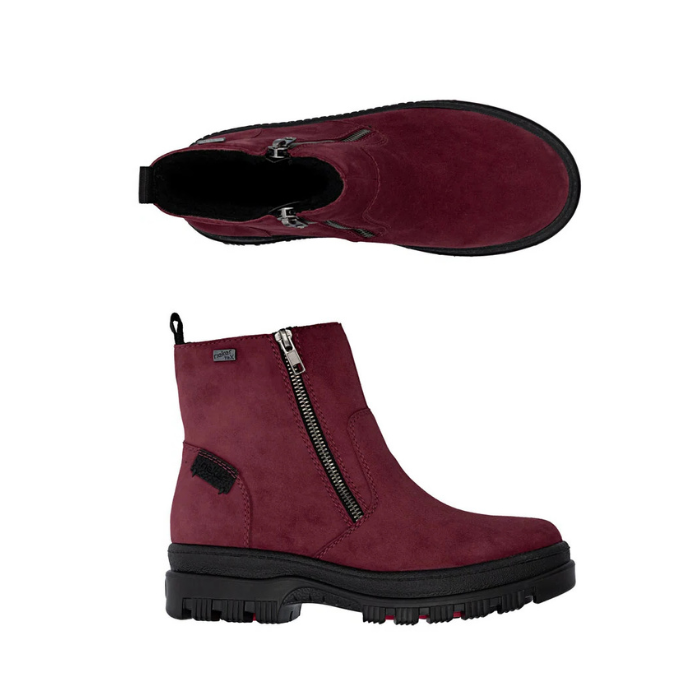 Pair of burgundy suede ankle boot with a black side zipper, black pull tab, and a chunky black lug outsole.