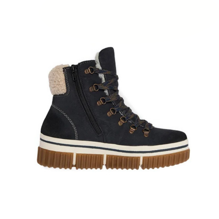 A dark navy blue high-top winter boot with a thick brown lug sole, inside zipper, a cream-colored fleece lining at the collar, and brown laces threaded through metal eyelets.