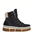 A dark navy blue high-top winter boot with a thick brown lug sole, inside zipper, a cream-colored fleece lining at the collar, and brown laces threaded through metal eyelets.