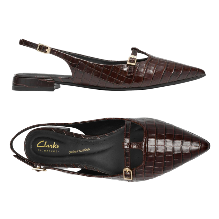 Pair of dark brown crocodile-embossed slingback flat shoes with a pointed toe, black Clark's logo'd footbed and gold-tone buckle details.