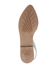 Criss-crossing line pattern tan outsole on slingback flat.