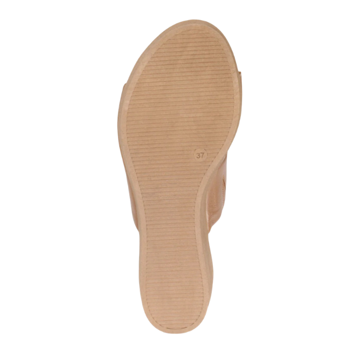 Tan light treaded outsole of slide sandal with size "37" stamped on side.