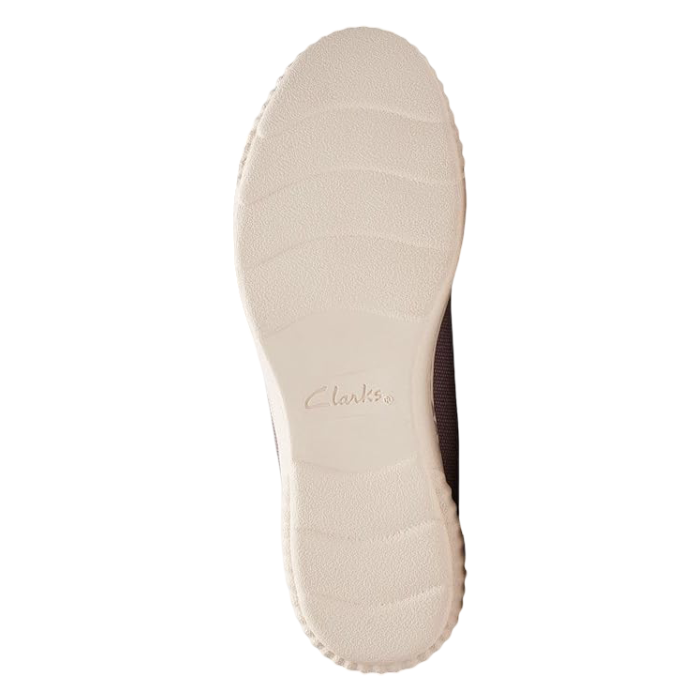 White outsole of sneaker with Clarks logo stamped in middle.
