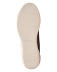 White outsole of sneaker with Clarks logo stamped in middle.