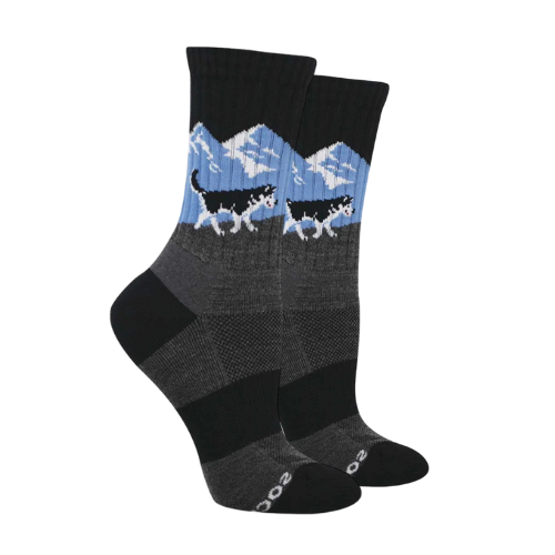 Black and grey socks with husky walking by a snowy mountain pattern.