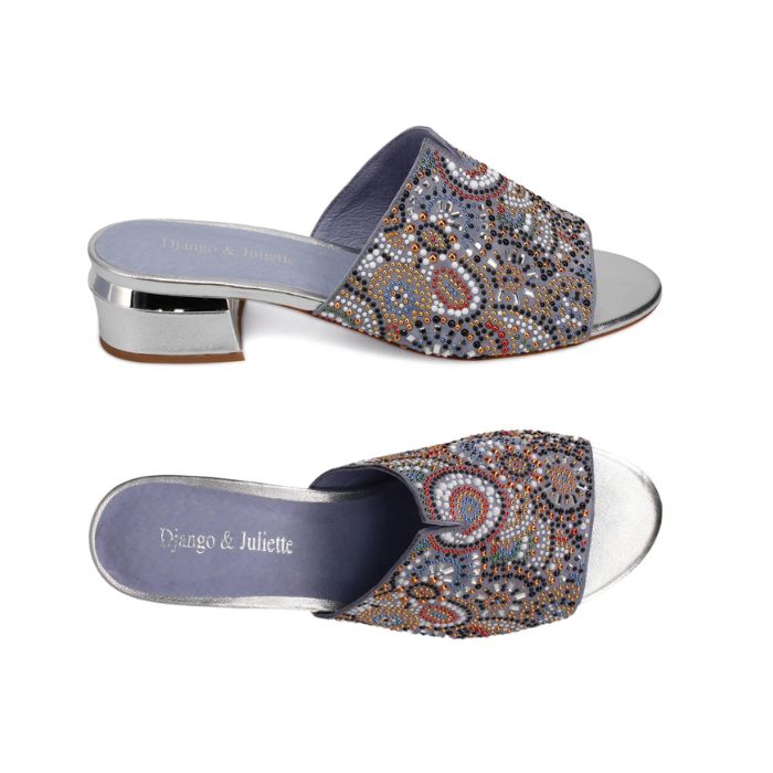 Top and side views of Django & Juliette Tammy heeled slide sandal in silver, showcasing intricate beadwork and cushioned footbed for comfort.