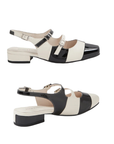 Pair of Black and white large checkered pattern slingback sandal with three buckle straps, white logo'd footbed and a low block heel.