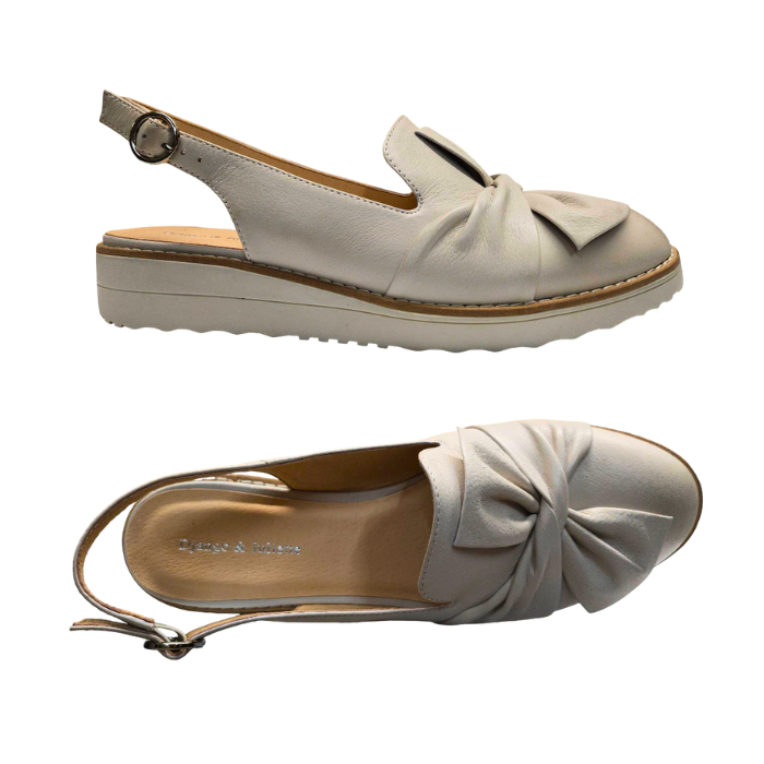 Pair of Beige slingbacks with knot style bow on vamp, tan D&J logo'd footbed and beige outsole.