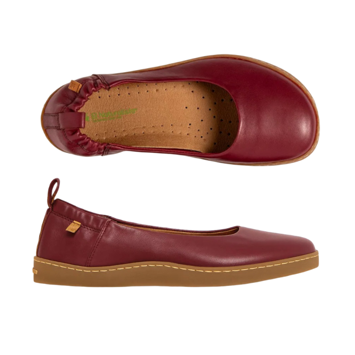 Pair of burgundy ballet flats with heel tab, tan El Naturalista logo'd footbed and tan outsole.