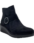 Navy blue suede ankle boot with textured platform wedge. This boot has a buckle across ankle and a overlapping look at the top