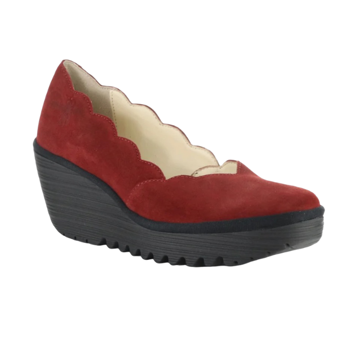 A single red suede wedge shoe with a scalloped edge and a chunky black platform outsole.