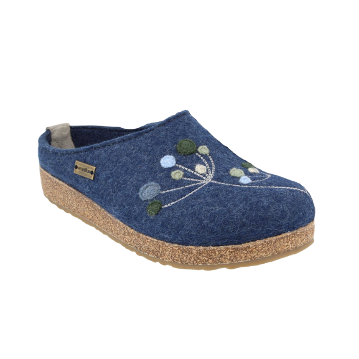 Blue wool slipper with floral design, cork midsole and tan rubber outsole.