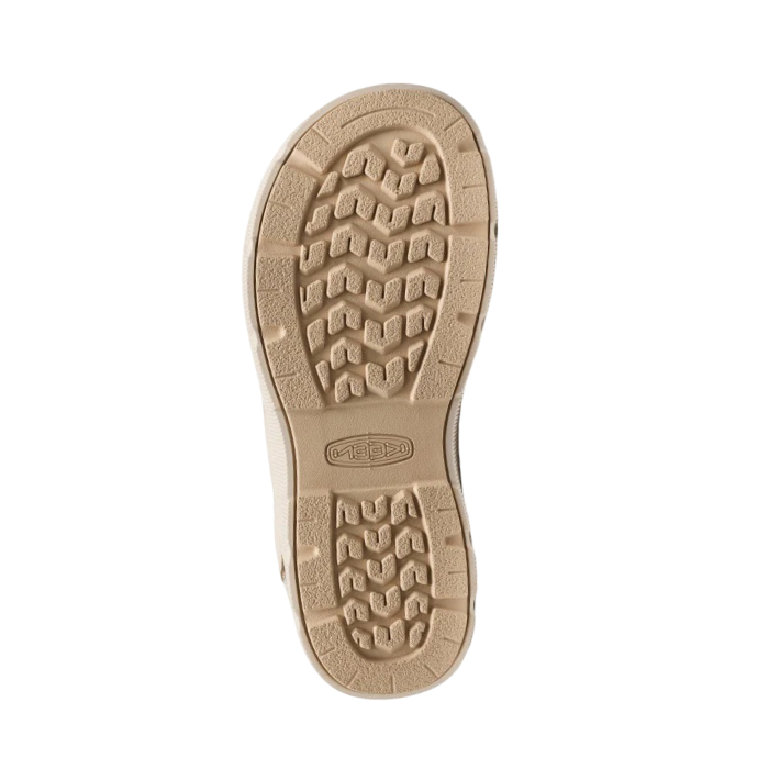 Tan outsole with deep tread pattern and Keen logo stamped in middle.