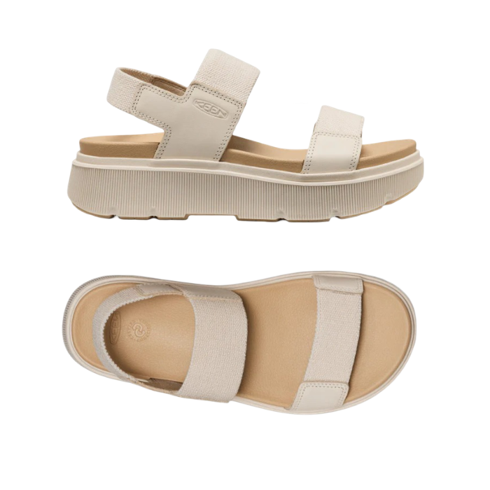 Pair of Beige sandals with toe, vamp and back elastic straps, tan footbed and platform outsole.