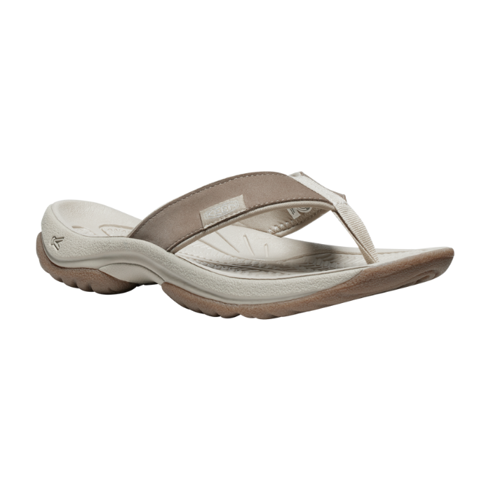 Beige thong sandal with rugged outsole.