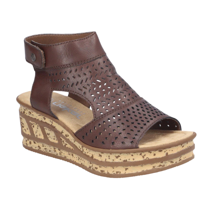 A brown leather wedge sandal with a perforated caged upper, ankle strap, and a thick cork-textured wedge heel.